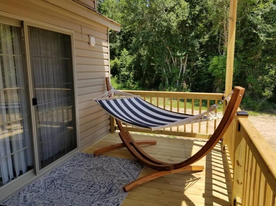 Tiny home with hammock loft BBQ and yard